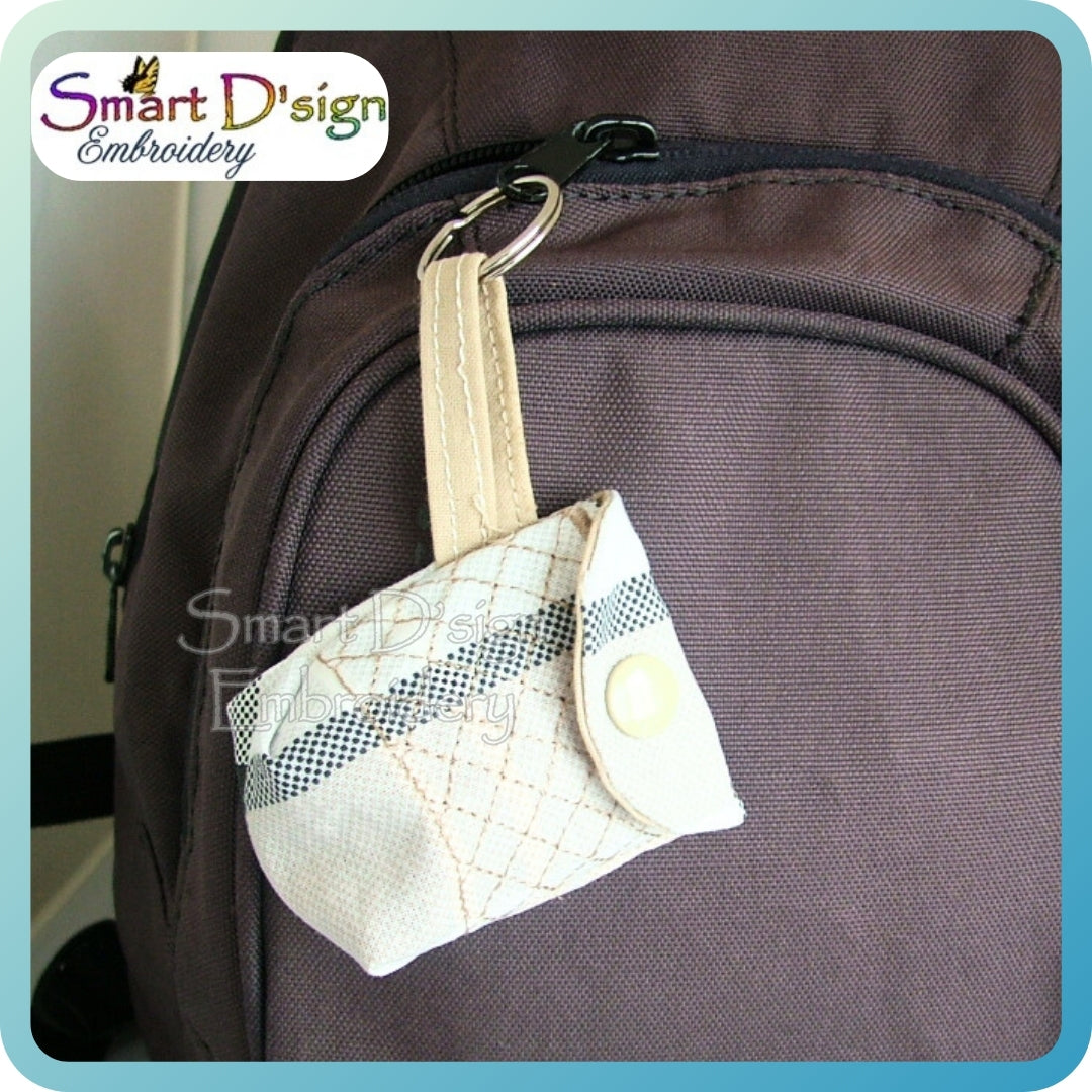 White embroidered pouch attached to a brown bag with 'Smart D'sign Embroidery' branding.