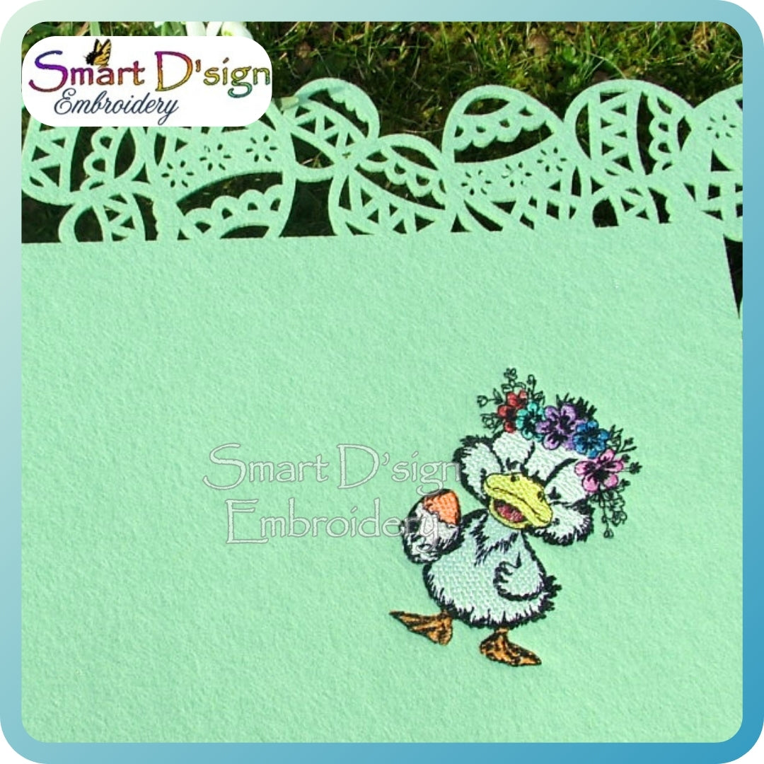 Embroidered design of a duck with flowers on a green fabric with Smart D'sign Embroidery branding.